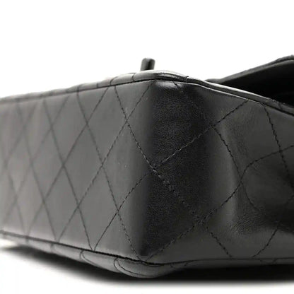 Chanel quilted lambskin double flap bag, dark black corner close to top seam and quilting