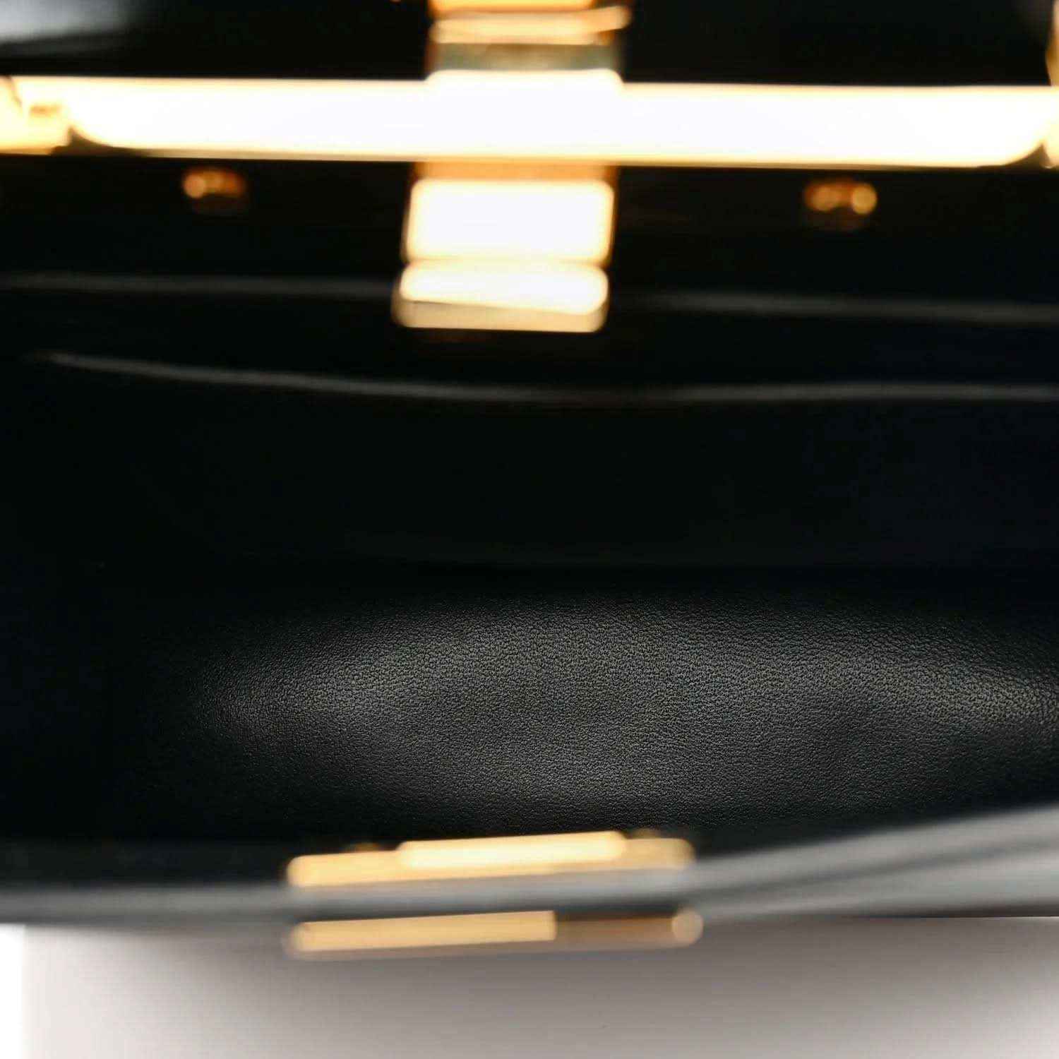 Black leather satchel close-up with fine grain texture