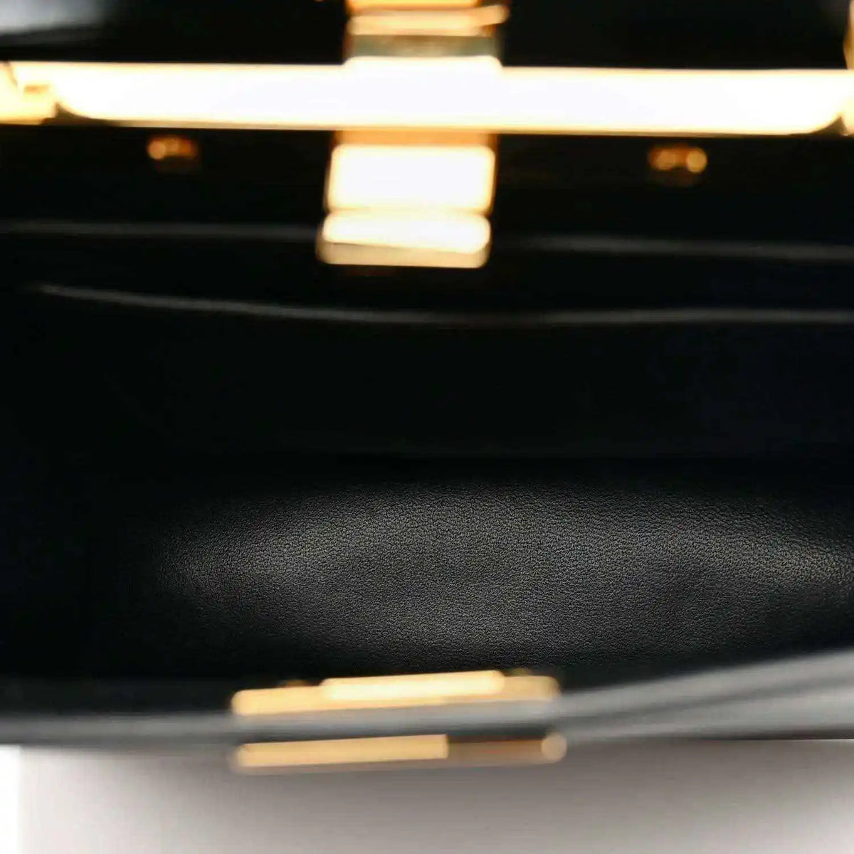 Black leather satchel close-up with fine grain texture