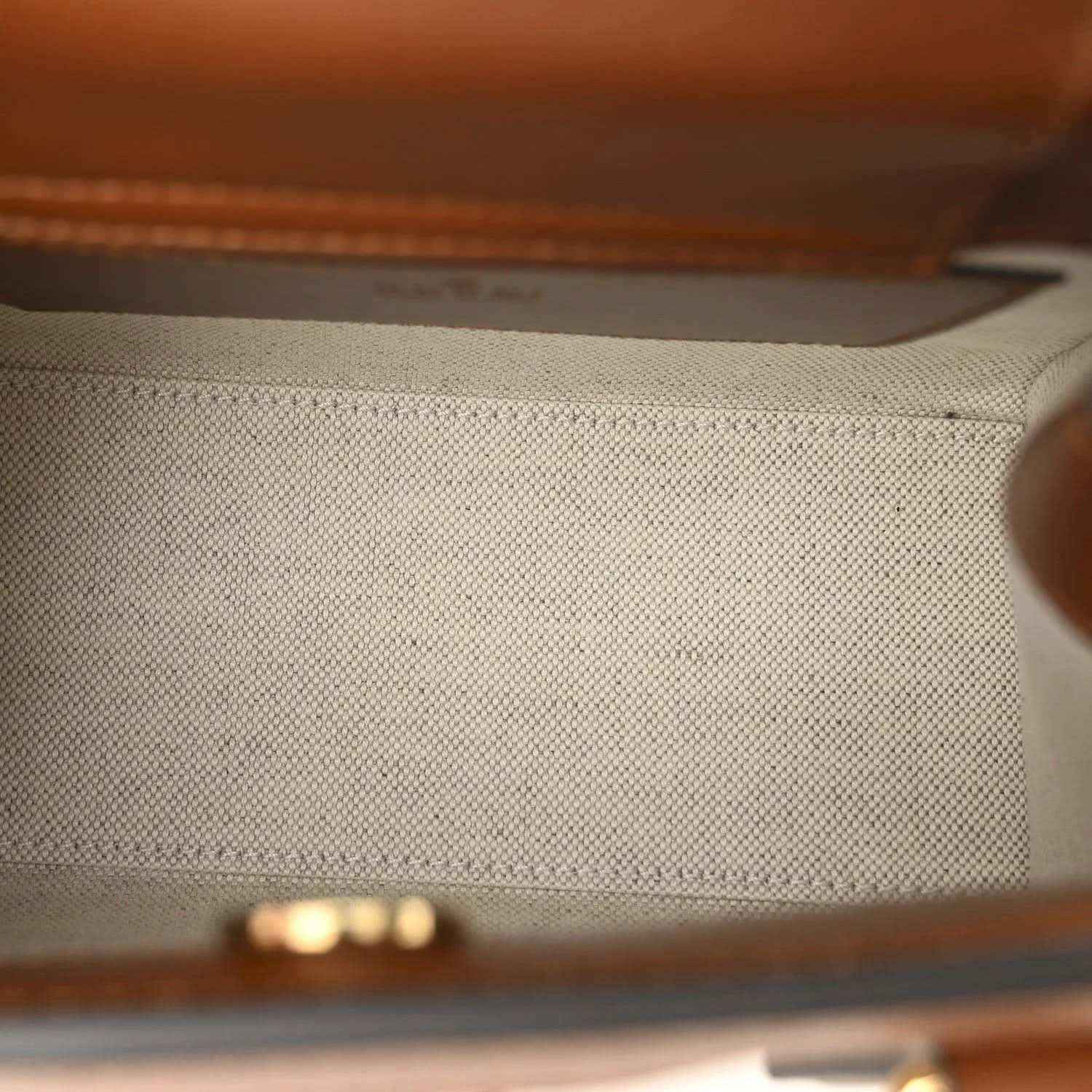 Mini tote bag interior lining detail with brown leather edge trim