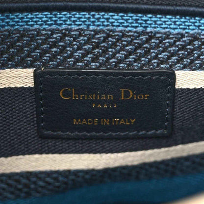 Interior label patch reading Christian Dior, Paris, made in Italy, on navy fabric