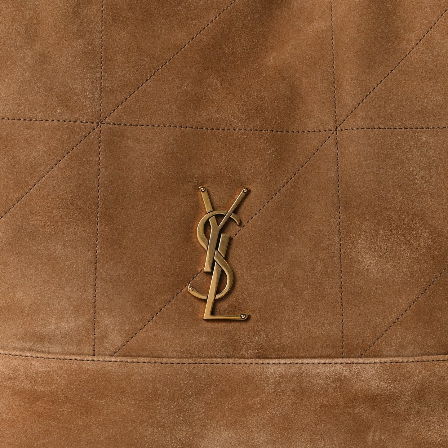 YSL metal logo on quilted suede front panel of medium tote bag