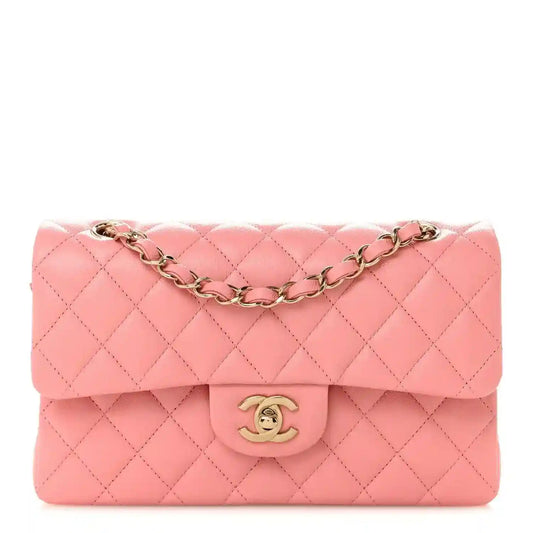 Light pink quilted small double flap bag with gold chain strap and CC logo