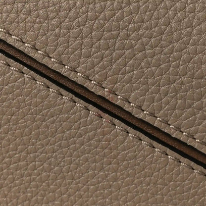 Small Puzzle bag grained calfskin texture with dark leather strap detail