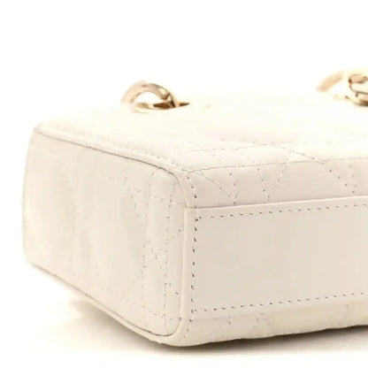 Cream micro lady D-Joy bag side view with quilted cannage texture