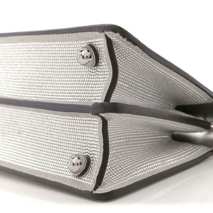 Silver crystal satchel with black edges and two snap tabs
