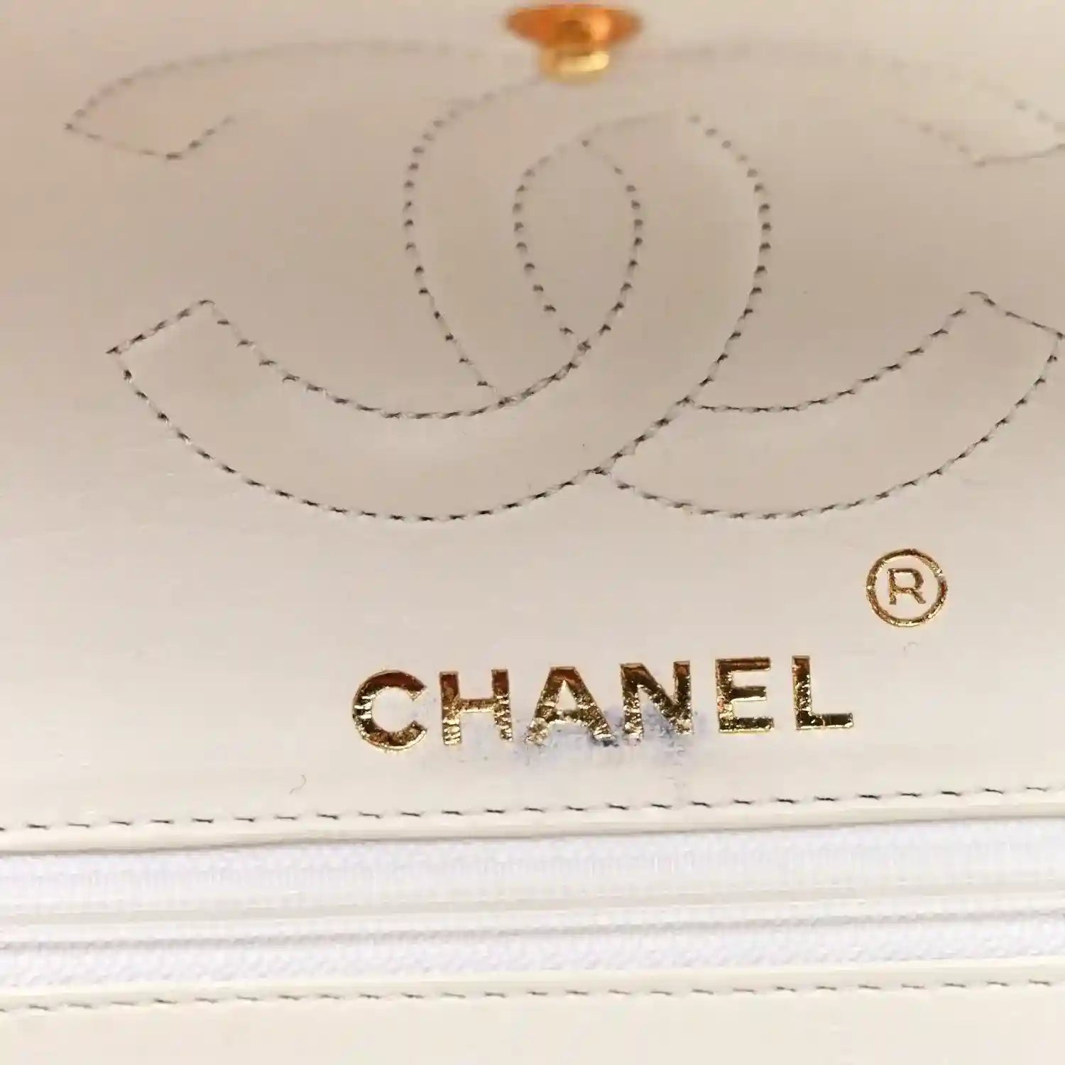 White lizard leather double flap bag, Chanel logo and gold emblem on front