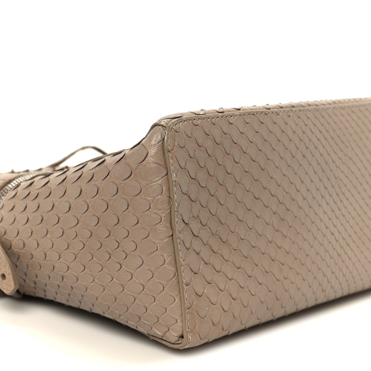 Matte snakeskin handbag close-up of side panel with structured body, taupe/grey tone