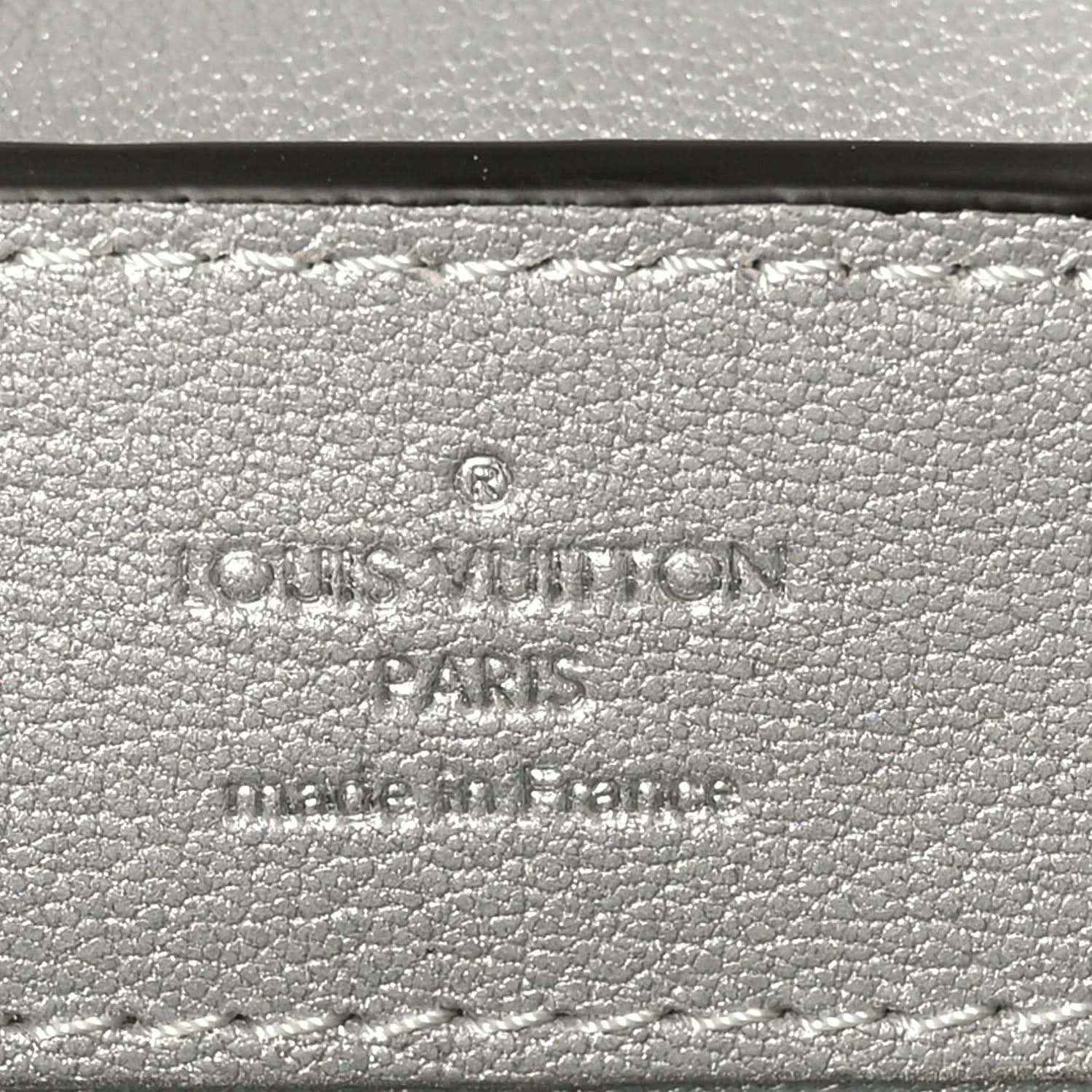 Louis Vuitton stamp on iridescent lizard mini handbag exterior