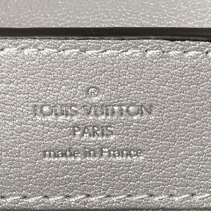 Louis Vuitton stamp on iridescent lizard mini handbag exterior
