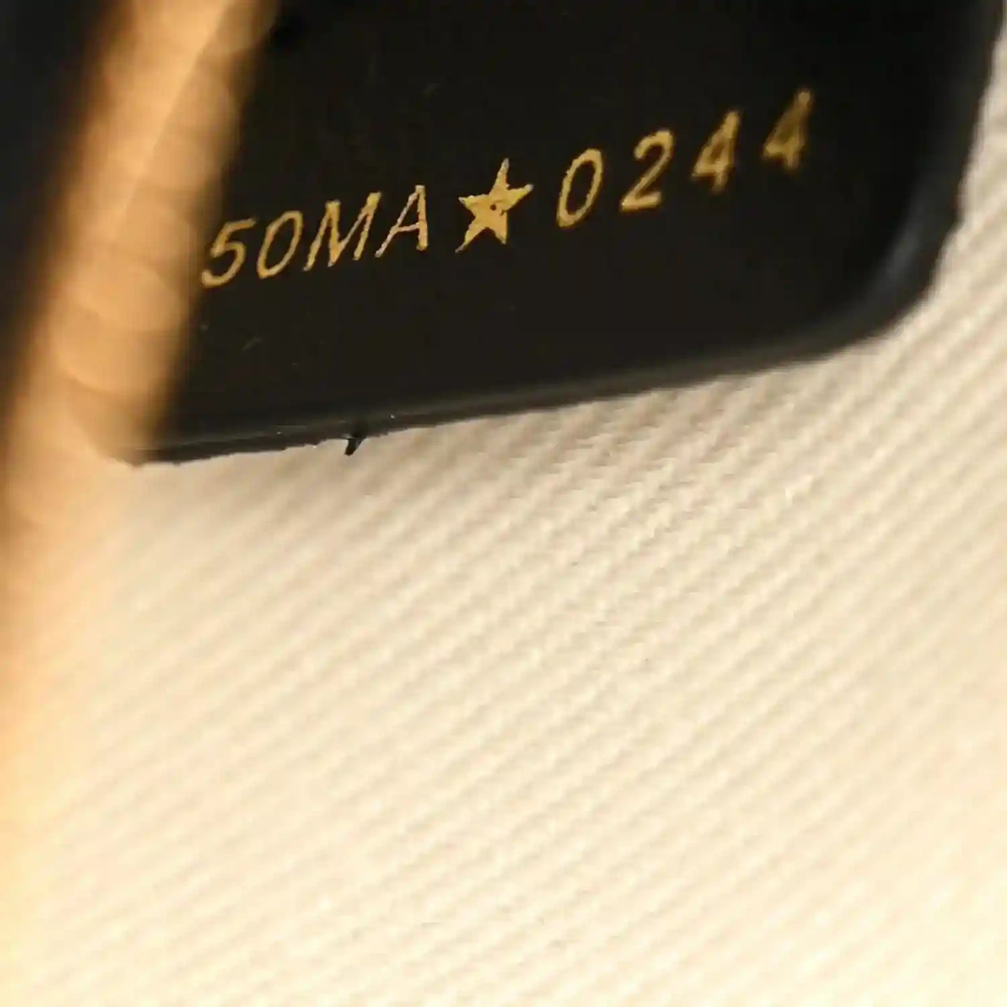 Christian Dior serial code stamp on handbag interior lining