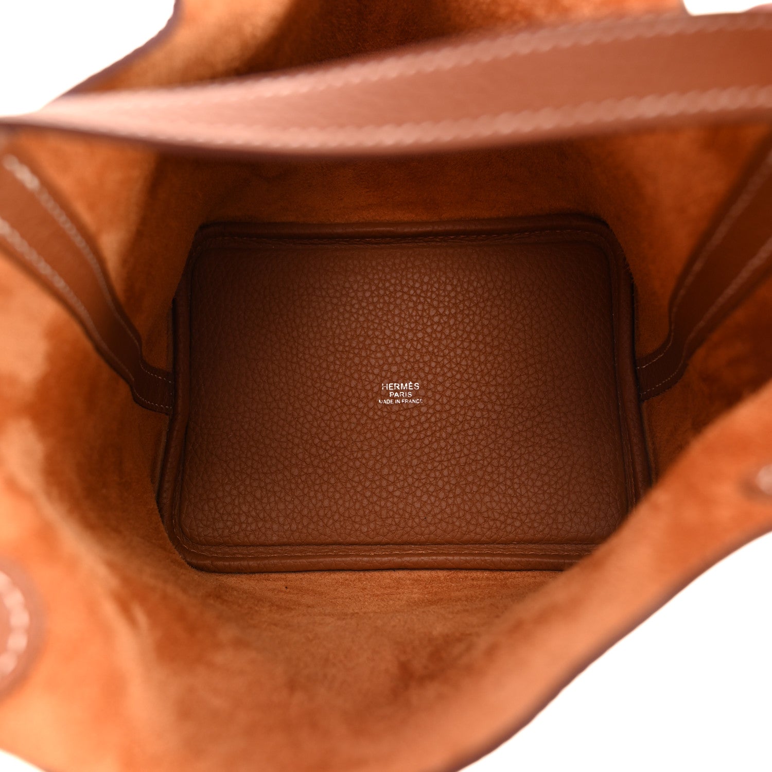 Cognac brown leather tote interior with stitched lining and center label