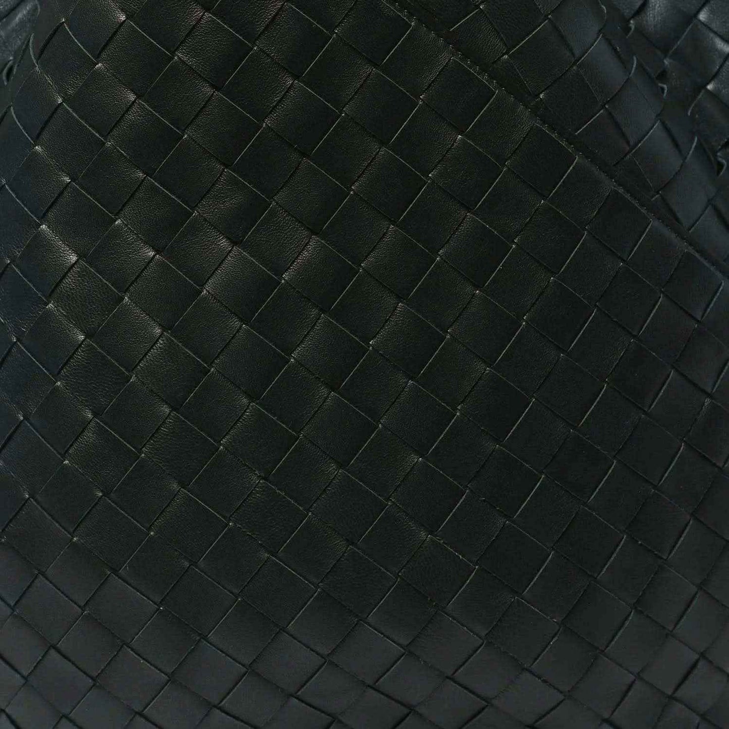 Close-up of dark green intrecciato woven leather pattern