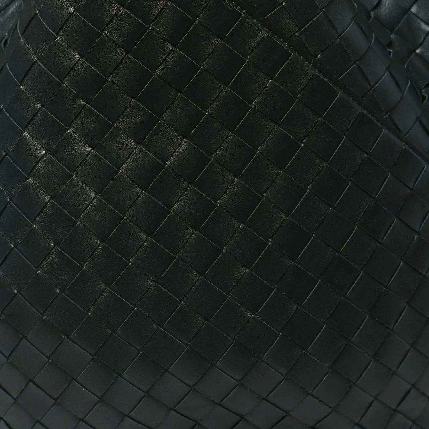 Close-up of dark green intrecciato woven leather pattern