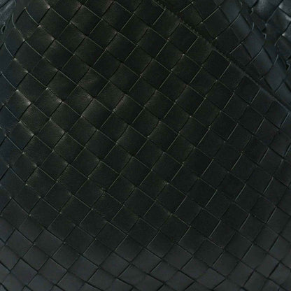 Close-up of dark green intrecciato woven leather pattern