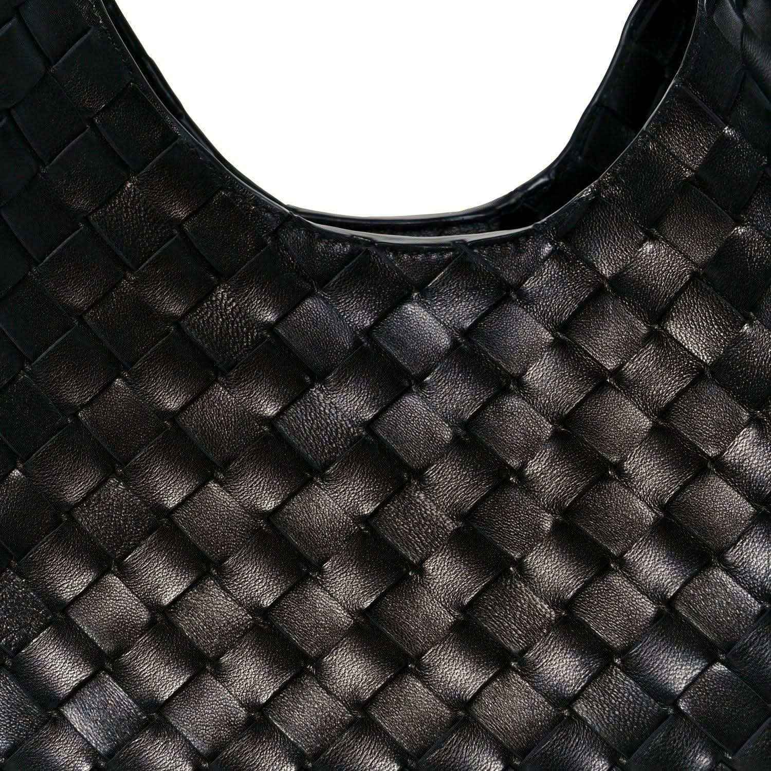 Black intrecciato leather shoulder bag close-up with woven square pattern