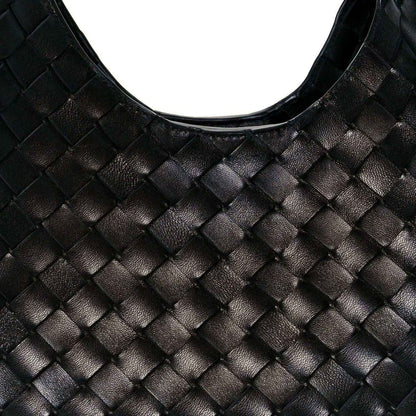 Black intrecciato leather shoulder bag close-up with woven square pattern