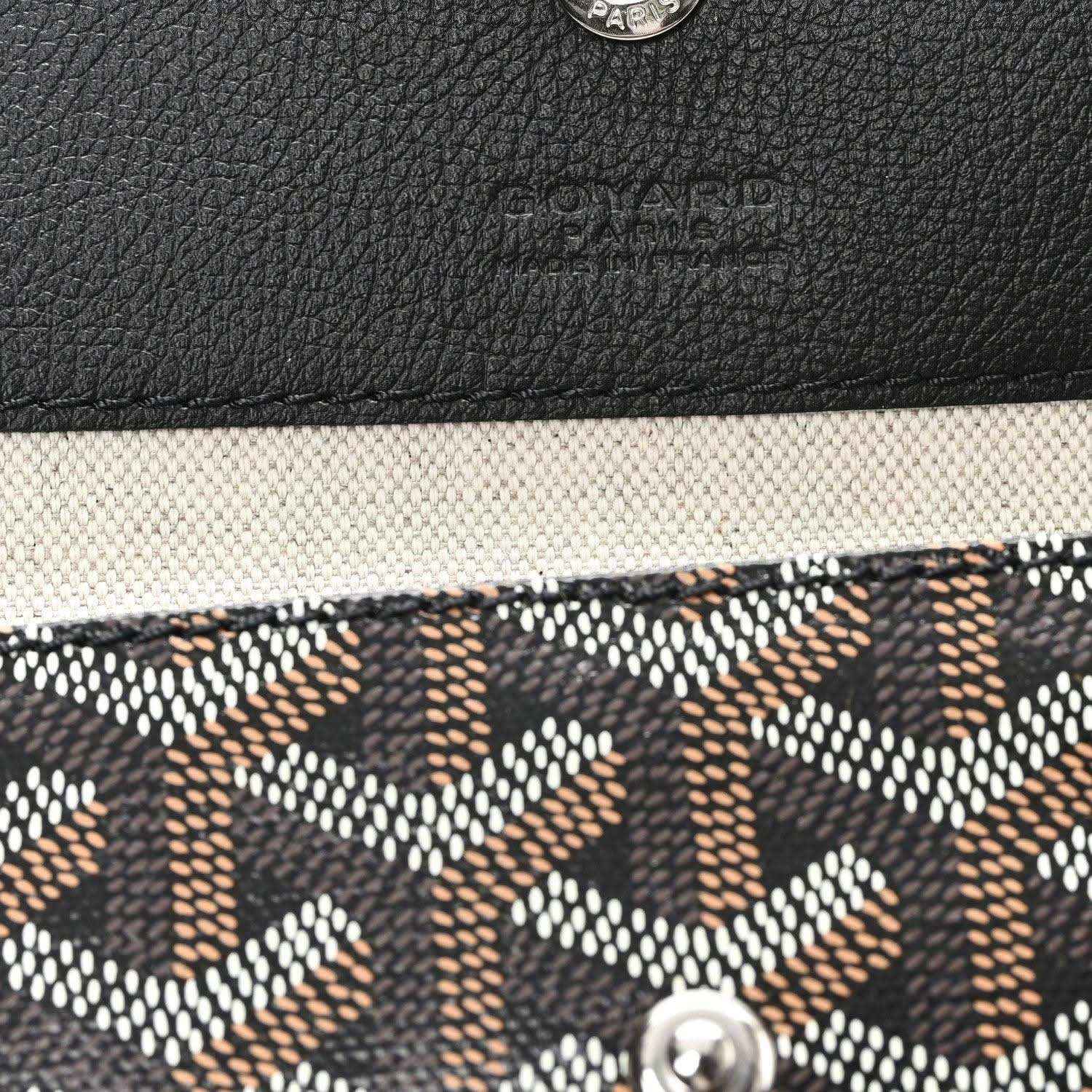 Goyardine tote corner detail with textured black leather trim and monogram canvas