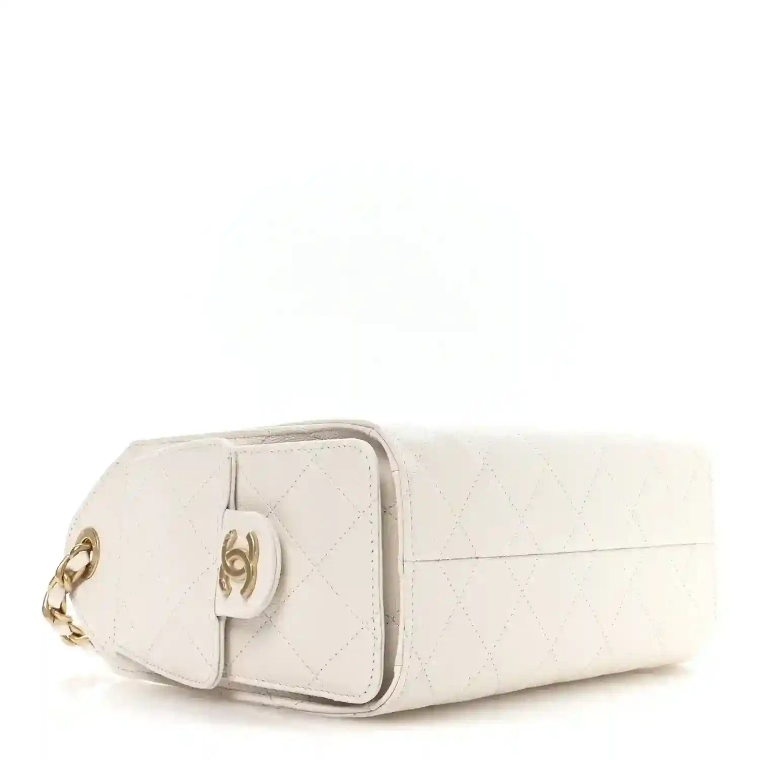 White mini handbag close side view with quilted panels and CC emblem hardware.