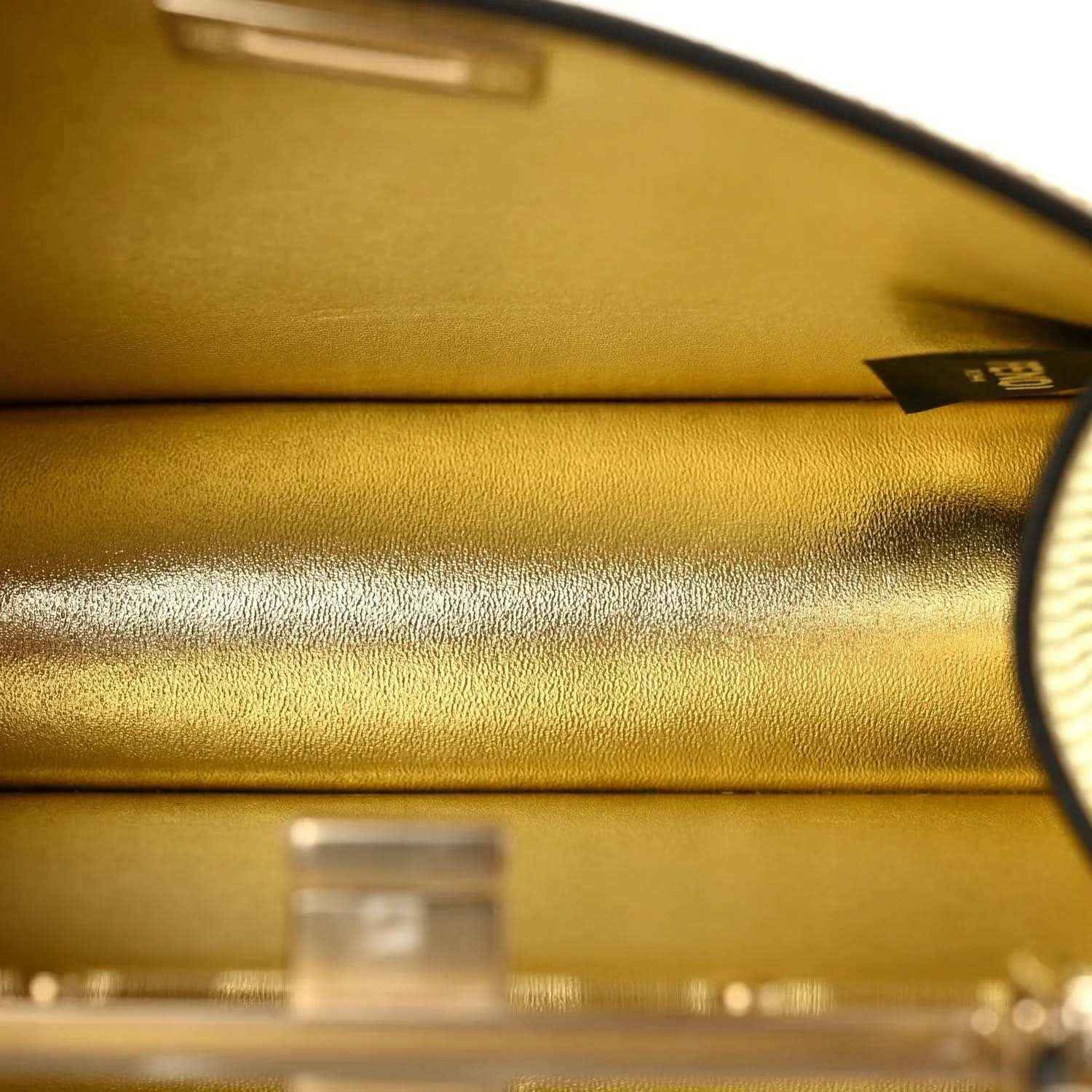 Gold interior lining with metal clasp hardware and curved top edge