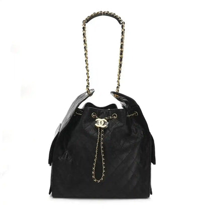 Black caviar quilted medium flap handbag with chain shoulder strap and gold logo clasp
