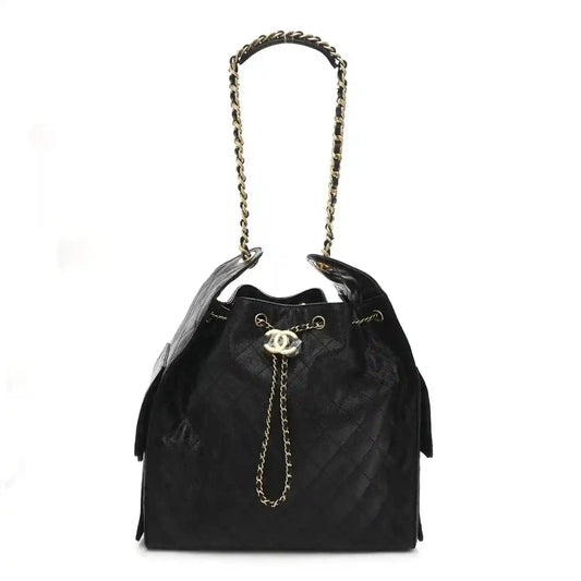 Black caviar quilted medium flap handbag with chain shoulder strap and gold logo clasp