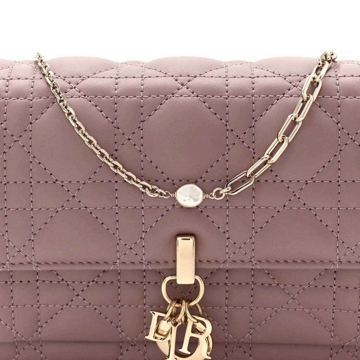 Purple quilted leather chain pouch bag with gold-tone chain and front clasp emblem