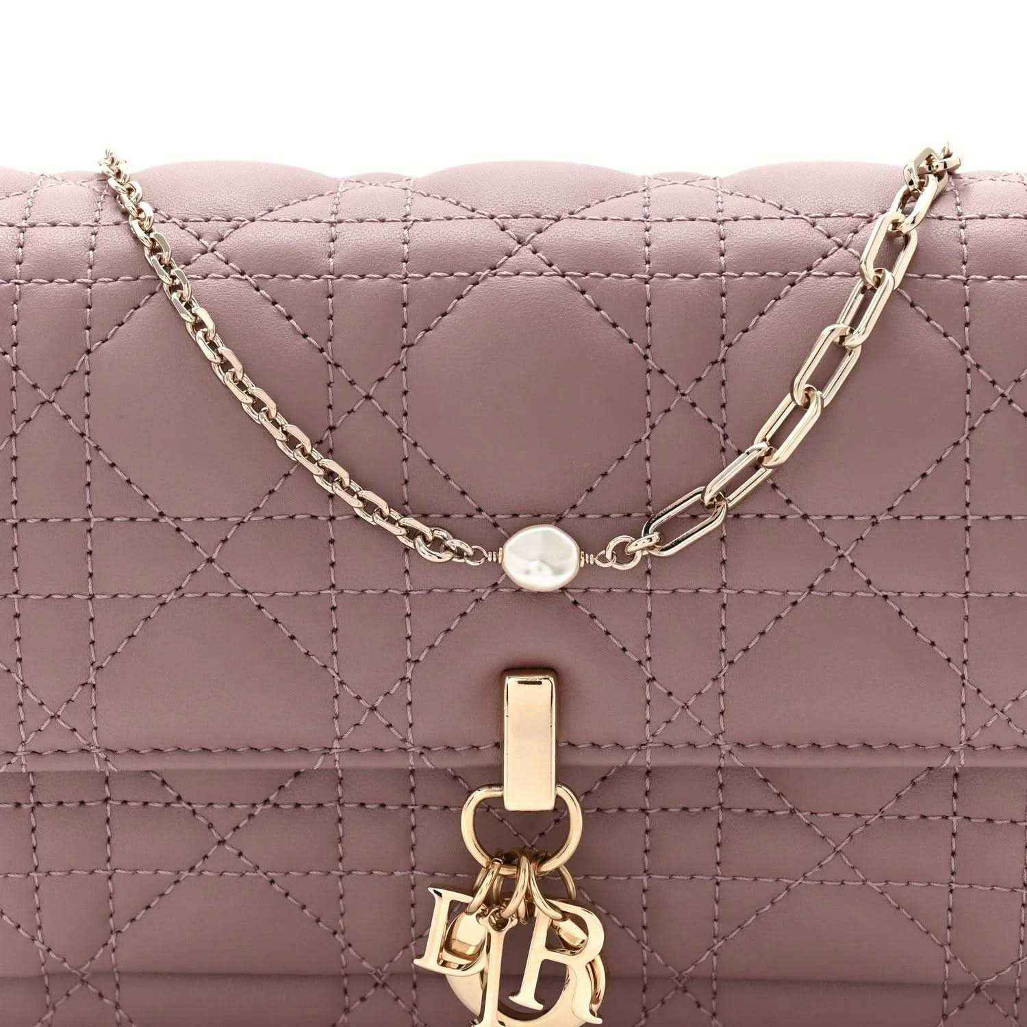 Purple quilted leather chain pouch bag with gold-tone chain and front clasp emblem