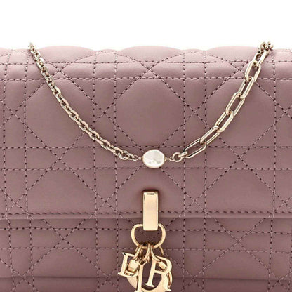 Purple quilted leather chain pouch bag with gold-tone chain and front clasp emblem