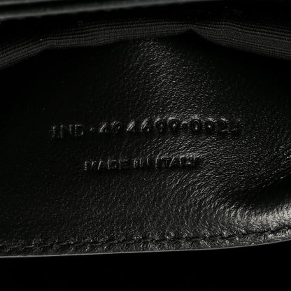Black leather interior lining with embossed markings and curved seam detail.