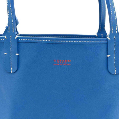Mini reversible tote bag, solid blue leather front panel with small Goyard logo
