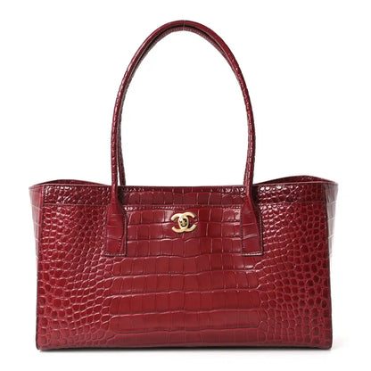 Small shopping tote bag in burgundy croc-embossed calfskin with top handles and logo clasp