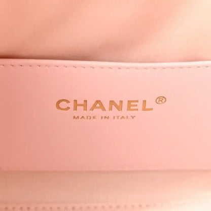 Chanel logo on light pink leather interior of mini 25 handbag