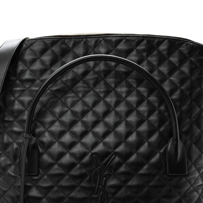 Saint Laurent ES quilted travel bag in black leather, quilted body with top handle detail.