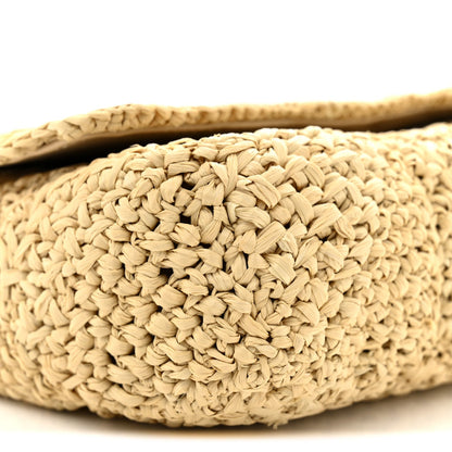 Natural raffia bag exterior close-up with braided woven texture