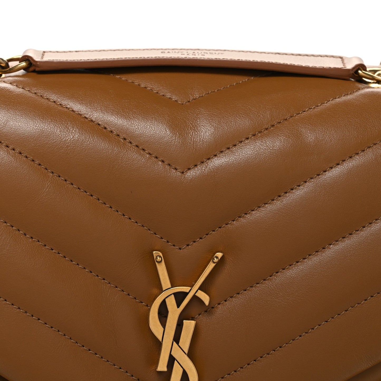 Tan quilted leather front with YSL monogram clasp and chevron stitched panel