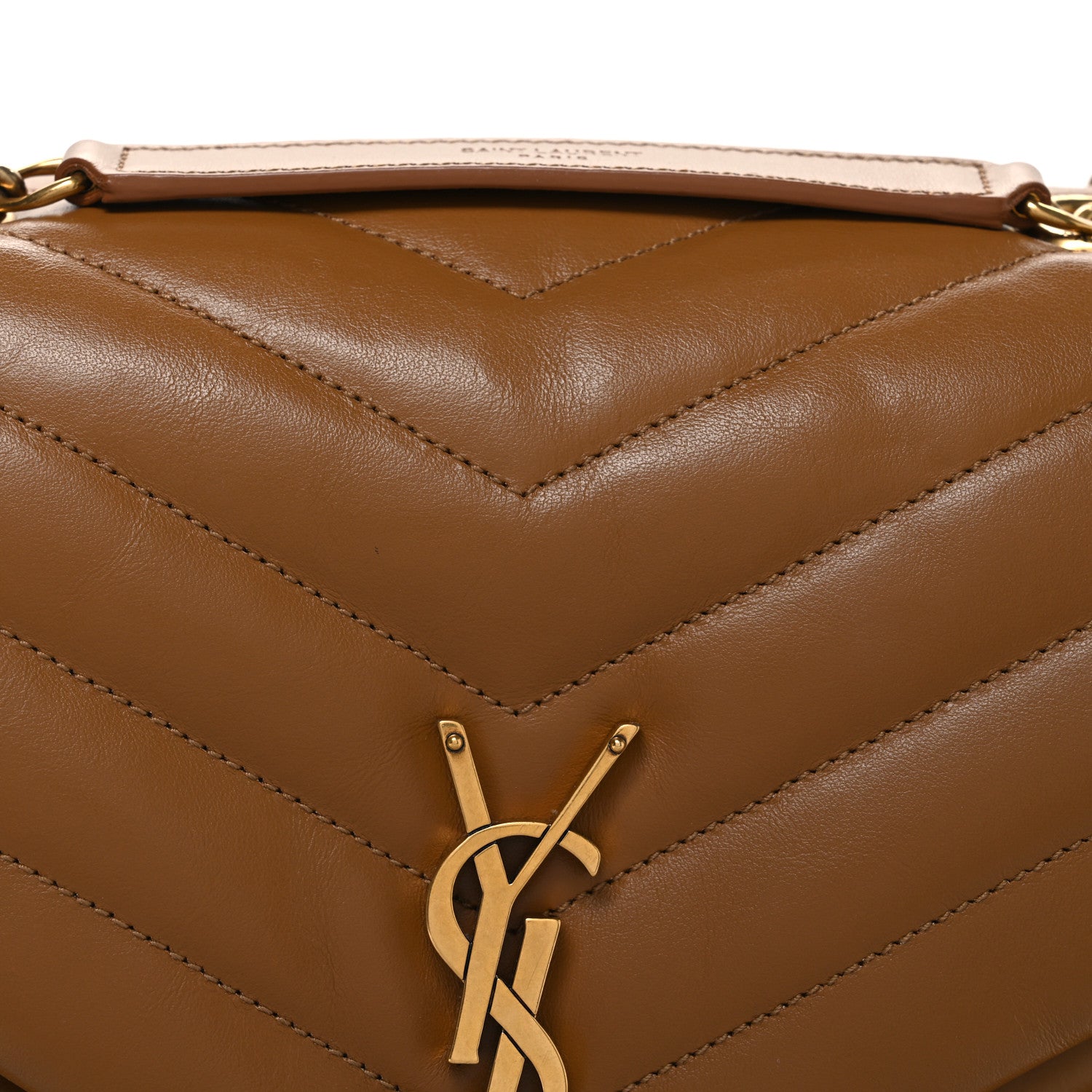 Tan quilted leather front with YSL monogram clasp and chevron stitched panel