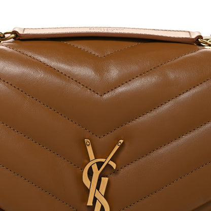 Tan quilted leather front with YSL monogram clasp and chevron stitched panel