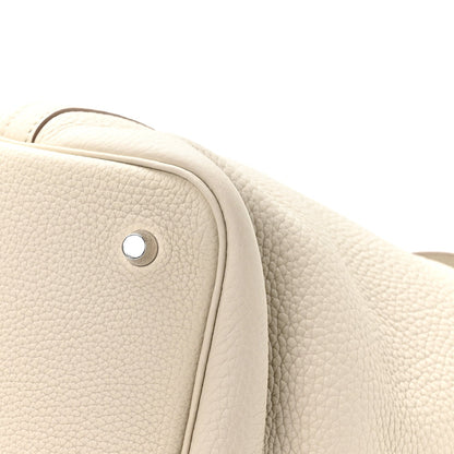 Ivory leather tote bag side panel with round metal button hardware
