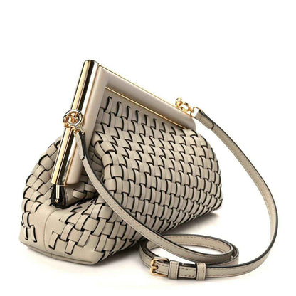 Ivory woven leather clutch crossbody bag with gold-tone frame and shoulder strap