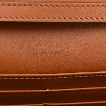 Tan leather interior with "MADE IN ITALY" embossed text and stitching