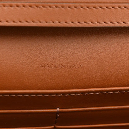 Tan leather interior with "MADE IN ITALY" embossed text and stitching