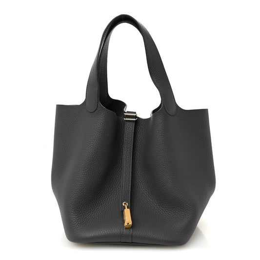 Small leather tote bag in dark gray with top handles and front vertical zip detail