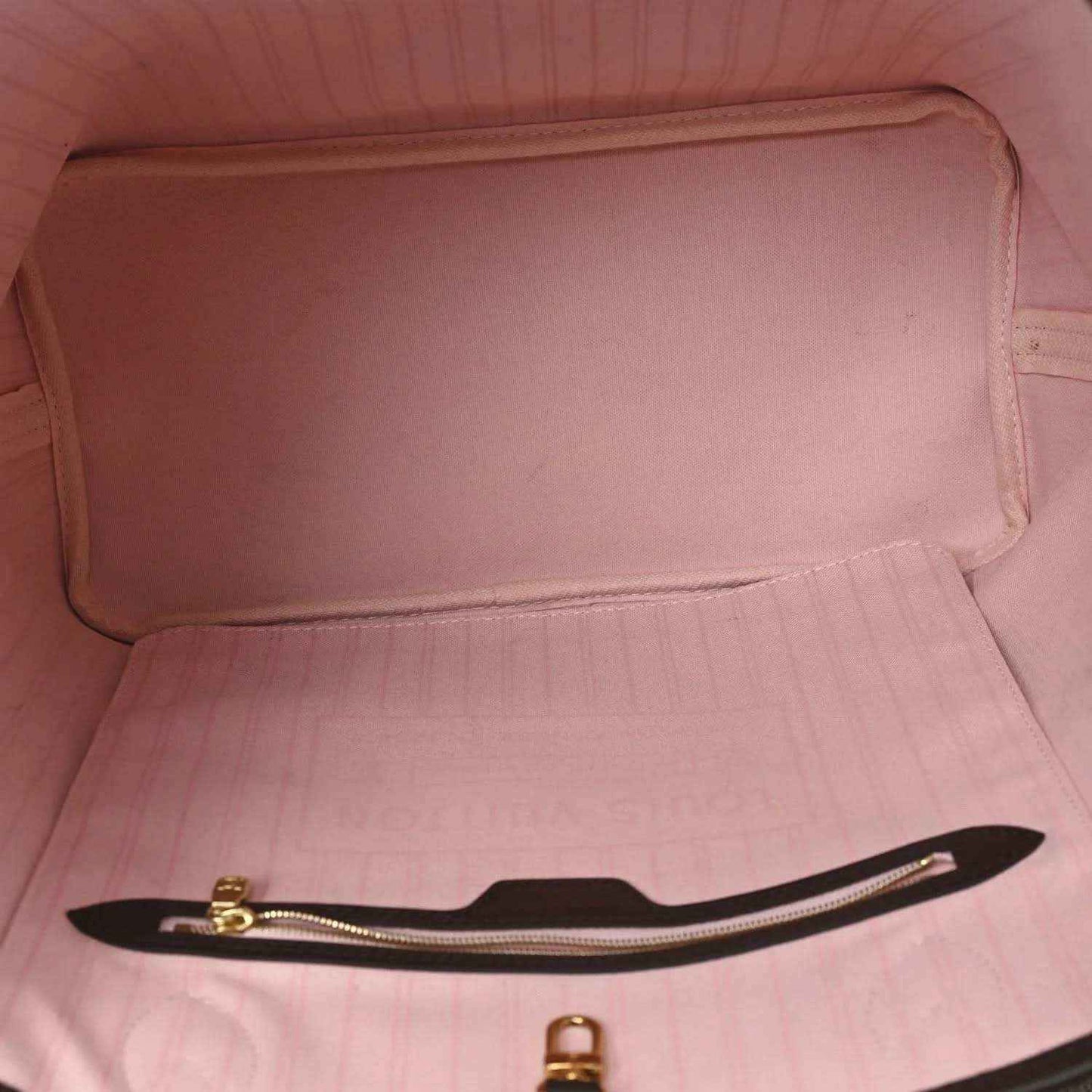 Louis Vuitton tote bag interior with pink fabric lining and zippered pocket opening
