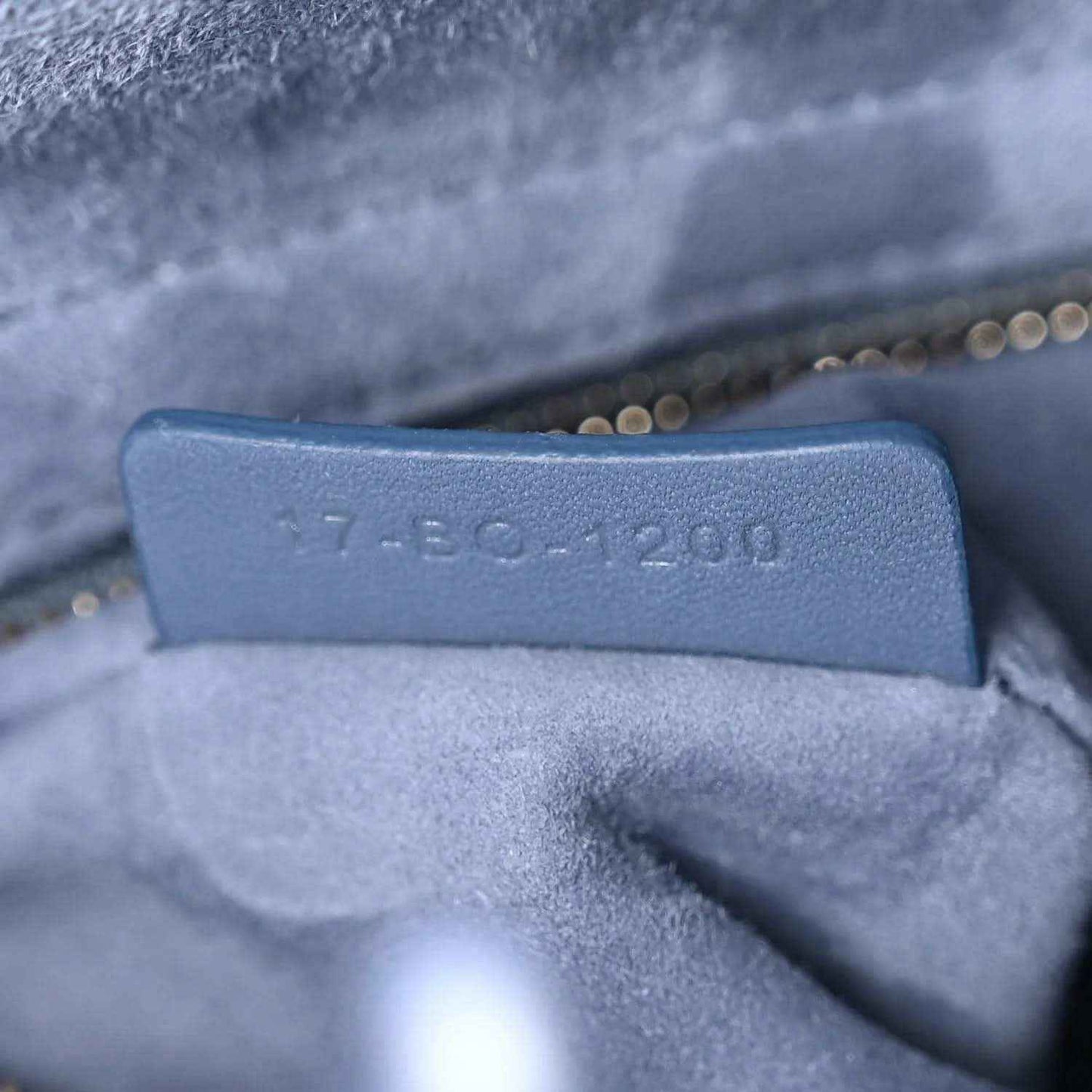 Interior stamp on Lady Dior bag lining near zipper