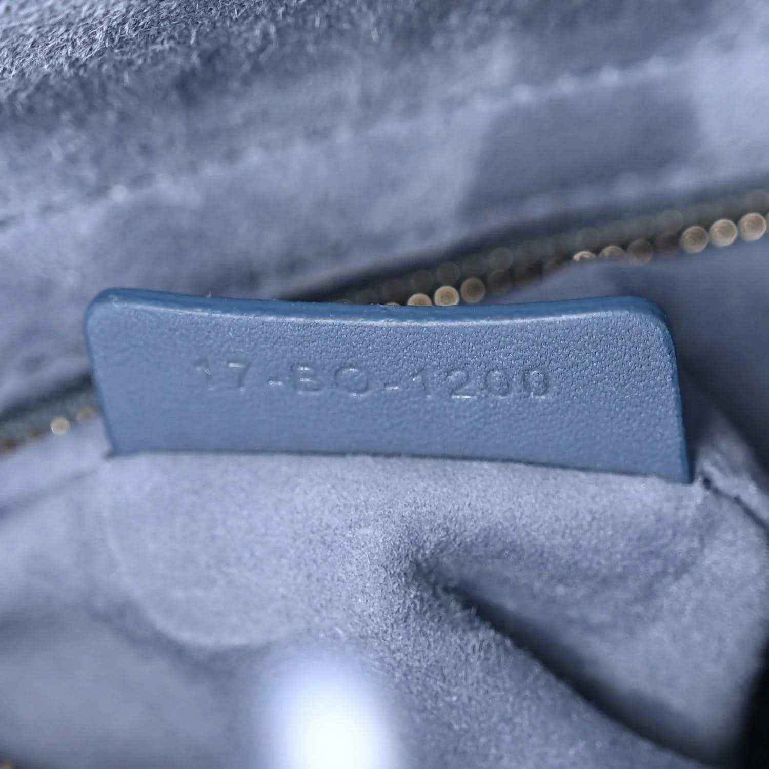 Interior stamp on Lady Dior bag lining near zipper