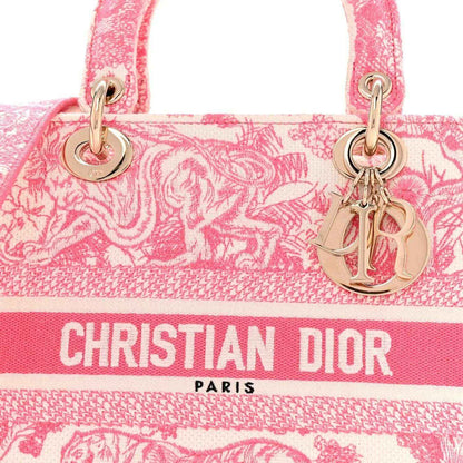 Pink embroidered tote front with Christian Dior Paris text and gold logo charm