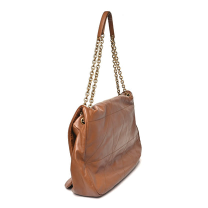 Tan quilted leather shoulder bag with gold chain strap, side view