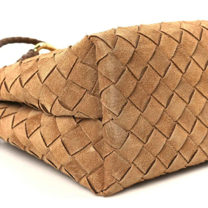 Amber suede intrecciato bottom corner with braided loop and woven texture