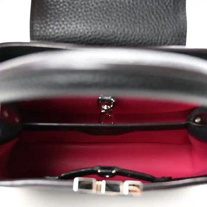 Louis Vuitton Capucines BB bag interior with red lining and clasp hardware
